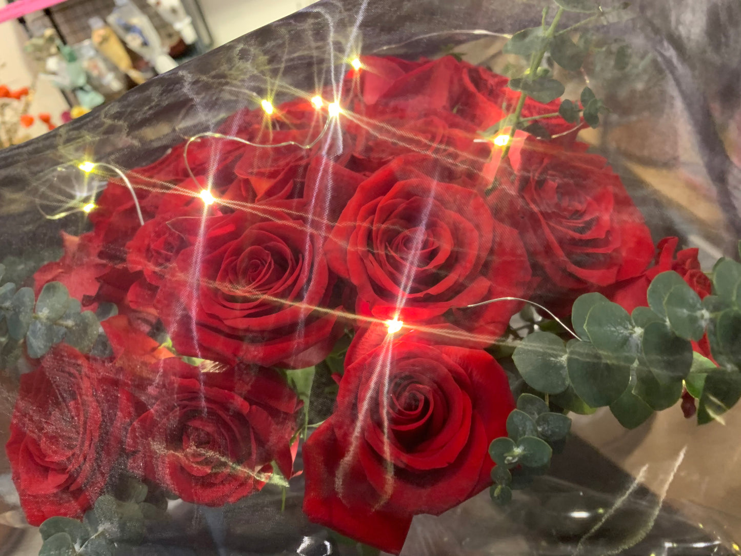 25 stems Red Roses in Mysterious wrapping with lights